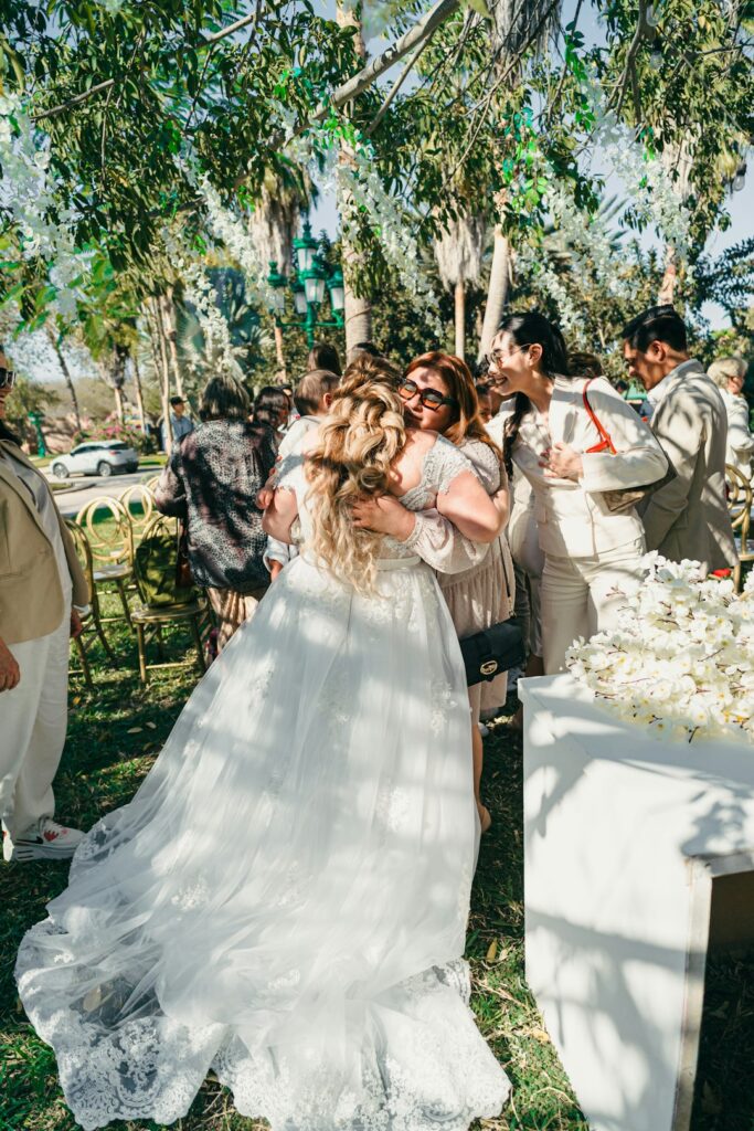 A couple sits together at a kitchen table reviewing a wedding checklist while taking a quiet break.